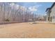 Large backyard featuring an expansive yard, privacy fence, and patio area at 806 Relic Rdg, Hampton, GA 30228