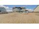 Expansive backyard view showcasing a large home, green space, and privacy fencing at 806 Relic Rdg, Hampton, GA 30228