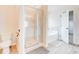 Bathroom featuring walk-in shower and soaking tub at 806 Relic Rdg, Hampton, GA 30228