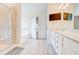 Bathroom featuring double granite countertop vanity, tile floors, and glass door shower at 806 Relic Rdg, Hampton, GA 30228