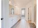 Bathroom featuring granite countertop double vanity and walk-in shower at 806 Relic Rdg, Hampton, GA 30228