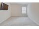 Bedroom with neutral carpet, window, and adjacent to bath, ideal for relaxation and privacy at 806 Relic Rdg, Hampton, GA 30228