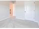 Spacious bedroom featuring neutral carpet, paint, and doors at 806 Relic Rdg, Hampton, GA 30228