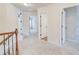 Second floor hallway shows access to secondary bedrooms and bath at 806 Relic Rdg, Hampton, GA 30228