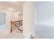 Second floor hallway overlooking stairs, with access to secondary bedrooms and baths at 806 Relic Rdg, Hampton, GA 30228