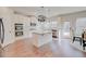 Bright kitchen with granite counters, stainless appliances, island, white cabinetry and a door to the outside at 806 Relic Rdg, Hampton, GA 30228