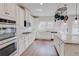 Stylish kitchen with double oven, granite counters, white subway tile, and stainless steel appliances at 806 Relic Rdg, Hampton, GA 30228