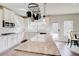 Charming kitchen featuring granite counters, stainless appliances, and a view into the breakfast area at 806 Relic Rdg, Hampton, GA 30228
