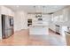 Modern kitchen with stainless appliances, center island, pendant lighting and granite counters at 806 Relic Rdg, Hampton, GA 30228