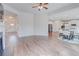 Spacious living room with fireplace and hardwood flooring connects to the kitchen with stainless appliances at 806 Relic Rdg, Hampton, GA 30228
