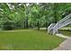 Large backyard with a stairway to an upper deck provides ample space for outdoor activities and relaxation at 1094 Regent Sw St, Atlanta, GA 30310