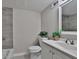 Clean bathroom featuring tiled walls and a sleek white vanity at 1094 Regent Sw St, Atlanta, GA 30310