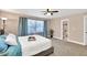 Cozy bedroom with plush carpeting, neutral walls, and a comfortable bed with ample natural light at 1094 Regent Sw St, Atlanta, GA 30310