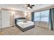 Bright bedroom with a large window, soft carpet, and stylish decor at 1094 Regent Sw St, Atlanta, GA 30310