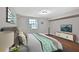 Cozy bedroom features hardwood floors, a comfortable bed, and ample natural light at 1094 Regent Sw St, Atlanta, GA 30310