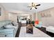 Bright living room with hardwood floors, a decorative rug, comfortable sofas and view to the kitchen at 1094 Regent Sw St, Atlanta, GA 30310