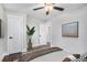 Light-filled bedroom with hardwood floors, two doors, and ceiling fan for optimal comfort at 1934 Pinedale Pl, Decatur, GA 30032
