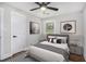 Cozy bedroom features neutral tones, a large window, and modern decor at 1934 Pinedale Pl, Decatur, GA 30032