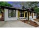 Charming home with brick facade, stylish wood accents, and new concrete driveway at 1934 Pinedale Pl, Decatur, GA 30032