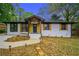 Charming home with a manicured lawn, brick facade, and stylish wood accents at 1934 Pinedale Pl, Decatur, GA 30032