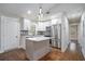 Bright kitchen featuring stainless steel appliances, white cabinets, and a center island at 1934 Pinedale Pl, Decatur, GA 30032