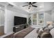 Spacious main bedroom with a large TV, ceiling fan, and view from the window at 1934 Pinedale Pl, Decatur, GA 30032