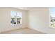 Spacious bedroom with blonde hardwood floors, white walls, and large windows for natural light at 260 Guild Ln, Fayetteville, GA 30214
