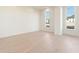 A spacious bedroom with hardwood floors, white walls and trim, and many windows for natural lighting at 260 Guild Ln, Fayetteville, GA 30214