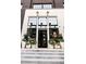 Native storefront with sleek black windows and elegant planters lining the entryway at 260 Guild Ln, Fayetteville, GA 30214