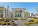 A modern two-story home has a blue front door and a garden in front with bushes and benches at 260 Guild Ln, Fayetteville, GA 30214