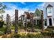 Beautifully landscaped front yard with a garden, seating, and a view of charming homes at 260 Guild Ln, Fayetteville, GA 30214