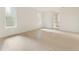 Bright interior view with white walls, wooden floor, and big windows for lots of natural light at 260 Guild Ln, Fayetteville, GA 30214