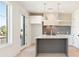 Modern kitchen with gray tile backsplash, stainless appliances, island, and pendant lights at 260 Guild Ln, Fayetteville, GA 30214