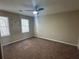 Bedroom featuring two windows and neutral walls at 4481 Dunmovin Nw Dr, Kennesaw, GA 30144