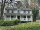 Charming two-story home with a welcoming front porch and classic design at 4481 Dunmovin Nw Dr, Kennesaw, GA 30144