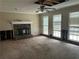 Living room with a stone fireplace and natural light at 4481 Dunmovin Nw Dr, Kennesaw, GA 30144