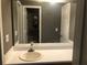 Bathroom with a single sink vanity, a mirror, and a door leading to the toilet and shower at 6434 Wellington Chase Ct # 6434, Lithonia, GA 30058