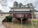 Exterior showcasing a spacious back deck area, perfect for outdoor entertaining and relaxation at 1606 King Rd, Riverdale, GA 30296