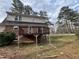 Exterior showcasing a spacious back deck area, perfect for outdoor entertaining and relaxation at 1606 King Rd, Riverdale, GA 30296