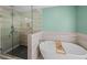 Serene bathroom featuring modern tub, glass shower, and spa-like design for ultimate relaxation at 53 Weatherstone Pkwy, Marietta, GA 30068