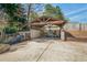 Covered carport with ample storage space for tools and equipment, surrounded by landscaping at 53 Weatherstone Pkwy, Marietta, GA 30068
