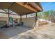Spacious carport featuring plenty of storage, surrounded by landscaping and a wooden fence at 53 Weatherstone Pkwy, Marietta, GA 30068