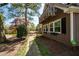 Two-story home with a balcony, stone pathway, flower boxes, and established trees at 53 Weatherstone Pkwy, Marietta, GA 30068