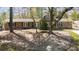 A charming single Gathering home with neutral siding, a front balcony, and mature trees at 53 Weatherstone Pkwy, Marietta, GA 30068
