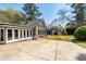 Home exterior featuring an expansive driveway, numerous windows, and a large backyard at 53 Weatherstone Pkwy, Marietta, GA 30068