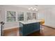 This kitchen island offers quartz countertop, shaker style cabinets, and a stainless steel undermount sink at 53 Weatherstone Pkwy, Marietta, GA 30068