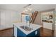Modern kitchen with quartz countertop island, stainless steel appliances, and unique storage options at 53 Weatherstone Pkwy, Marietta, GA 30068