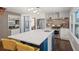 Bright, open kitchen with a quartz countertop island, stainless steel appliances, and modern finishes at 53 Weatherstone Pkwy, Marietta, GA 30068