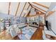 Bright living room featuring vaulted ceilings, wood beams, a modern fireplace, and hardwood floors at 53 Weatherstone Pkwy, Marietta, GA 30068