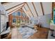 Stylish living room showcasing vaulted ceilings, wood beams, large windows, and a modern fireplace at 53 Weatherstone Pkwy, Marietta, GA 30068